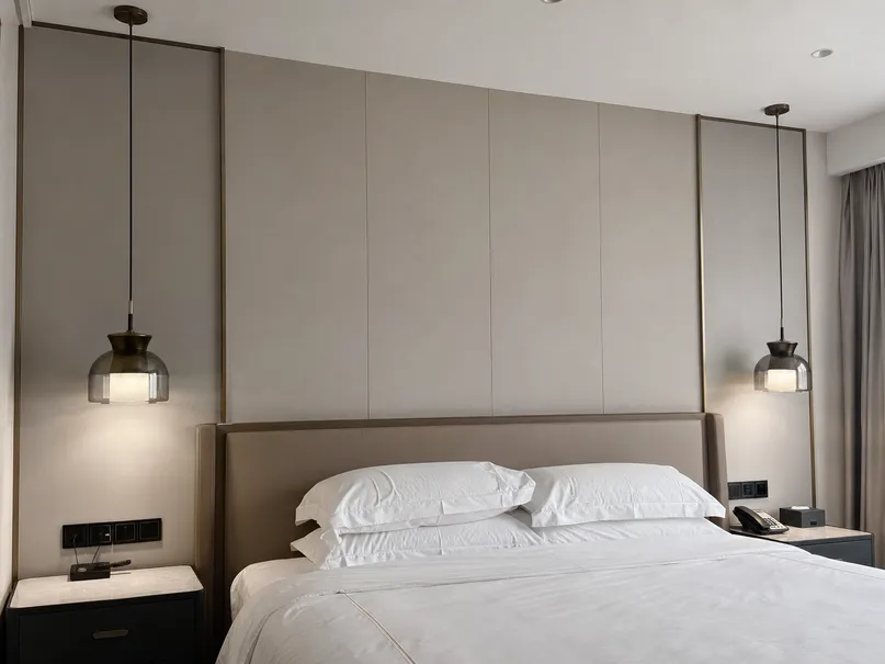 Bedside pendant lighting pairs with synchronized cord lengths for hotel and residential bedroom installations