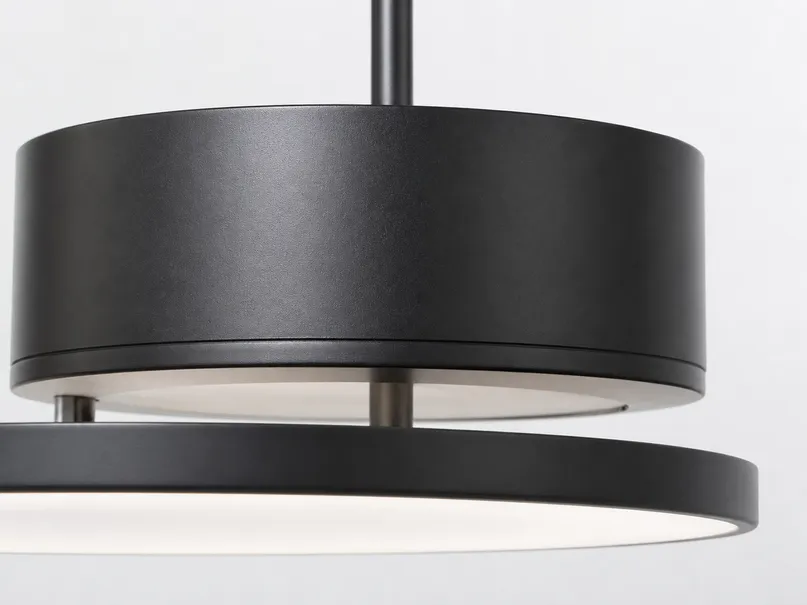 Dining room lighting fixture technical detail showing housing material and finish quality