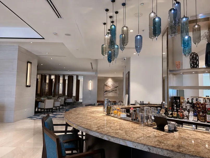 Cluster pendant lighting over hotel restaurant bar area