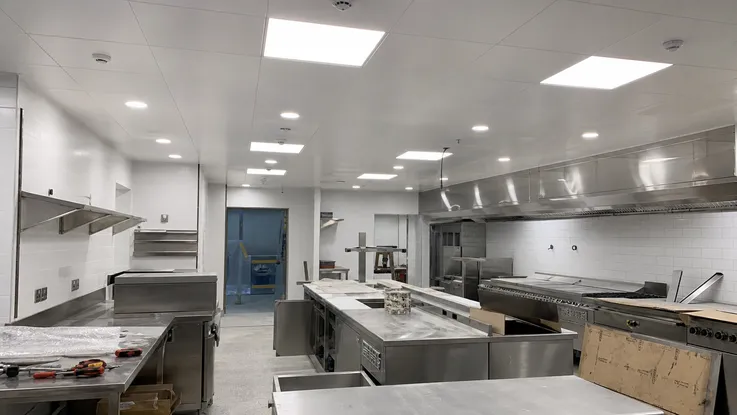 Hotel kitchen renovation with multiple zone lighting fixtures meeting CE and UL certification