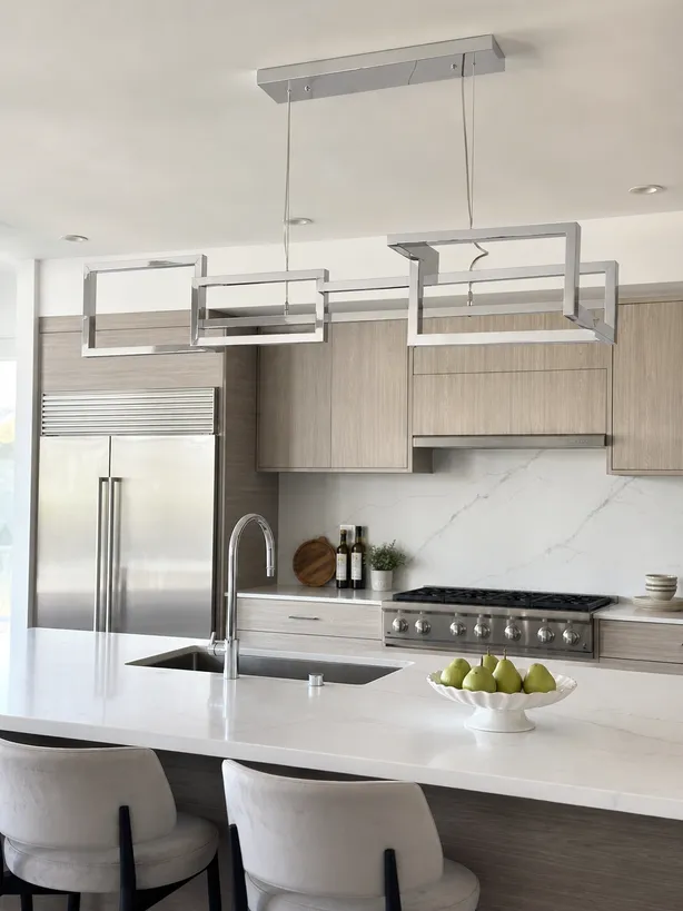 Modern geometric kitchen chandelier in aluminum with electroplated finish over kitchen island