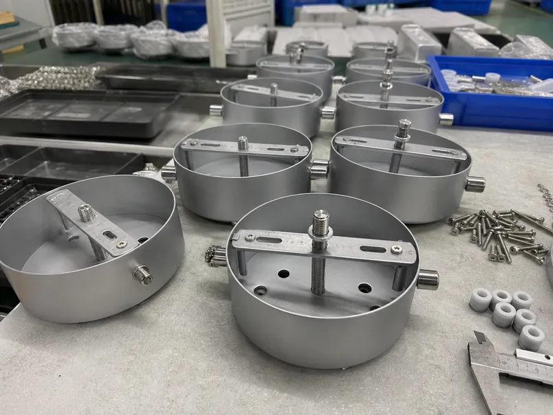CNC-machined canopy components for kitchen lighting fixtures showing precision mounting hardware