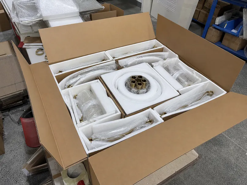Foam-lined export packaging for multi-arm chandelier with reinforced outer carton