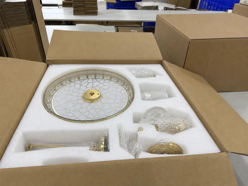 EPE foam-lined inner carton with decorative ceiling fixture securely packed for ocean freight