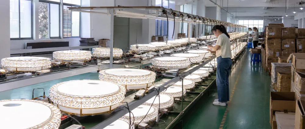 Decorative ceiling fixtures undergoing 100% aging test on powered burn-in line before export packing