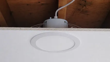 Recessed ceiling light profile showing fixture sitting inside ceiling cavity with cutout