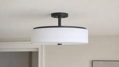 Semi-flush ceiling light profile showing housing dropped 100-300mm from ceiling on short stem