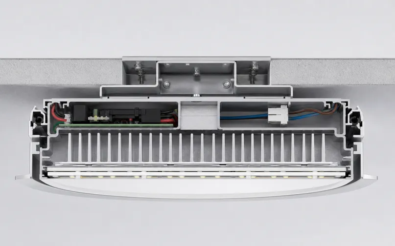 Cross-section view of ceiling fixture mounting showing weight distribution and thermal management