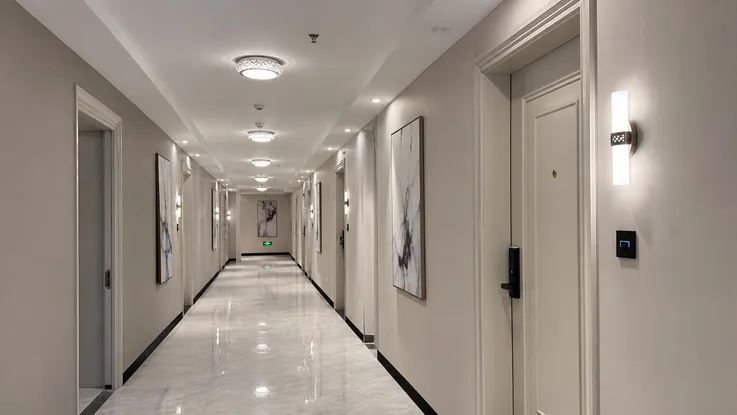 Flush mount and luxury ceiling fixtures installed in boutique hotel corridor