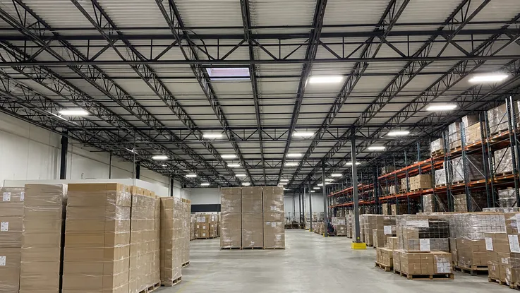 Industrial ceiling fixtures in a logistics center
