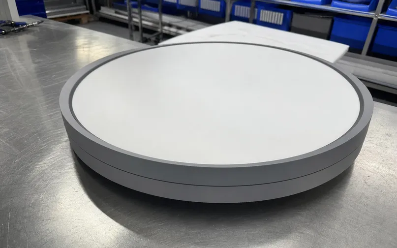 Industrial ceiling fixture showing clean geometry and matte finish construction