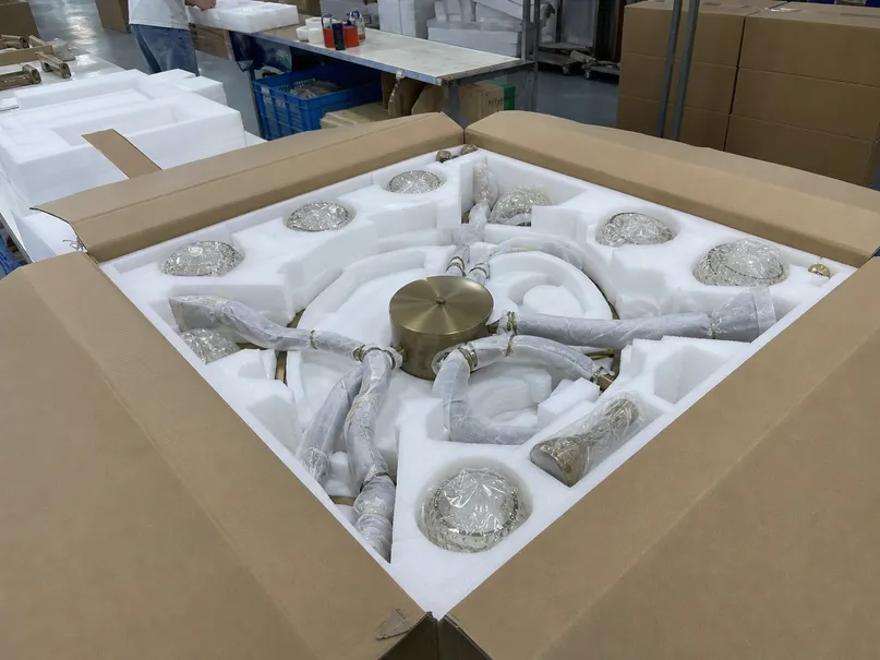 Die-cut foam-lined inner carton with luxury ceiling fixture secured for ocean freight