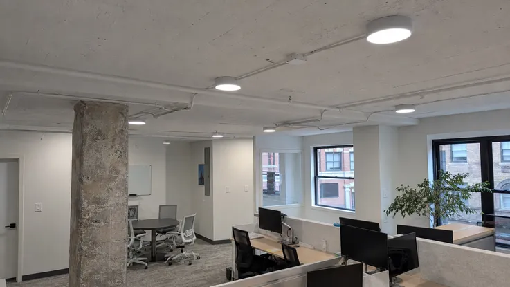 Surface-mount modern ceiling fixtures in commercial office retrofit