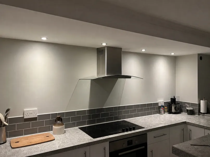 Recessed kitchen lighting installed above countertop showing neutral white color temperature and narrow beam task lighting