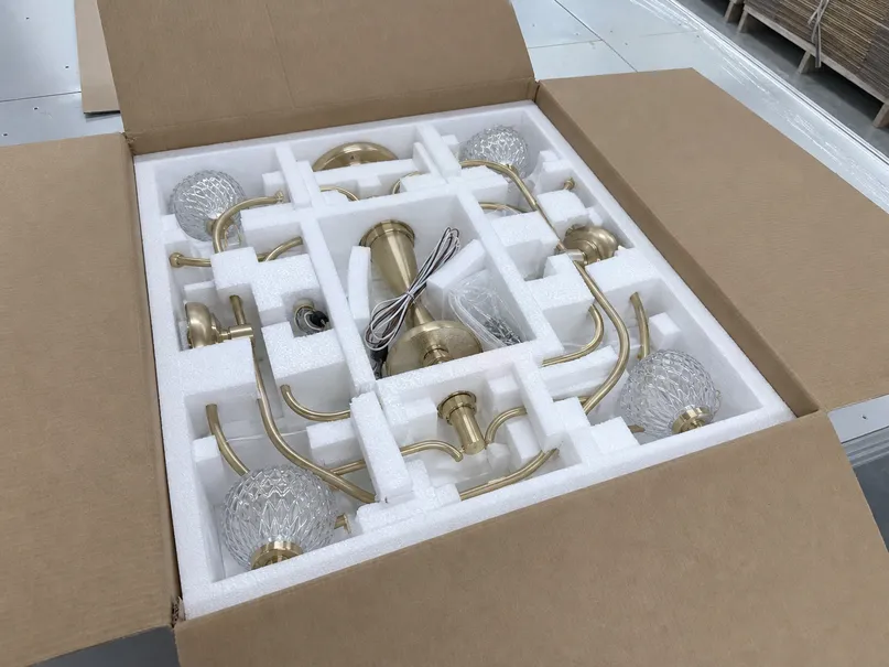Foam-lined inner carton packaging for chandelier pendant lighting with secured arm positions
