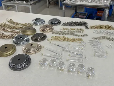 Chandelier accessories including canopy plates, chains, and crystal drops
