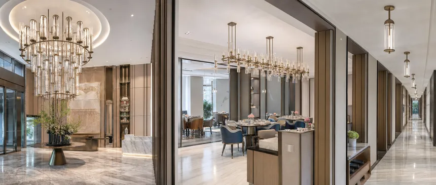 Custom chandeliers installed across hotel lobby, restaurant, and corridor applications