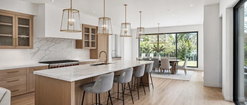 Kitchen chandelier installed in luxury residential project with consistent finish across multiple fixtures