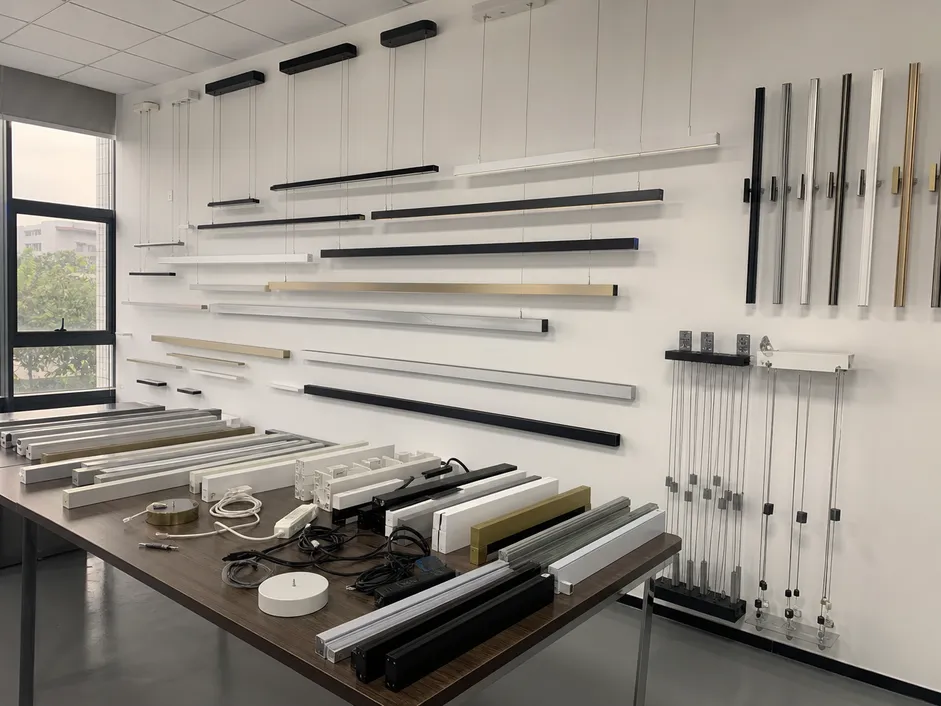 Linear chandelier finish and length customization options displayed in factory showroom