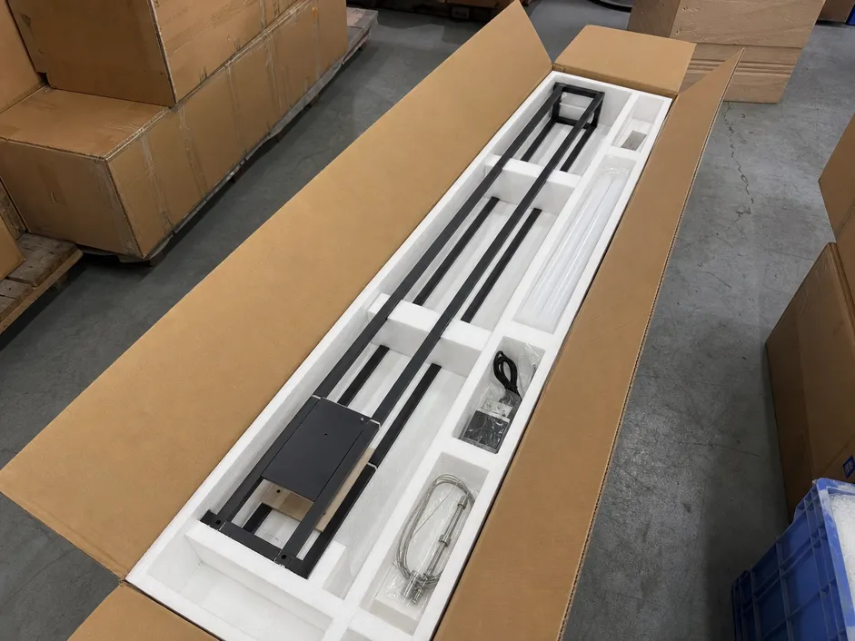 Foam-lined export carton with internal bracing engineered for linear chandelier frame geometry
