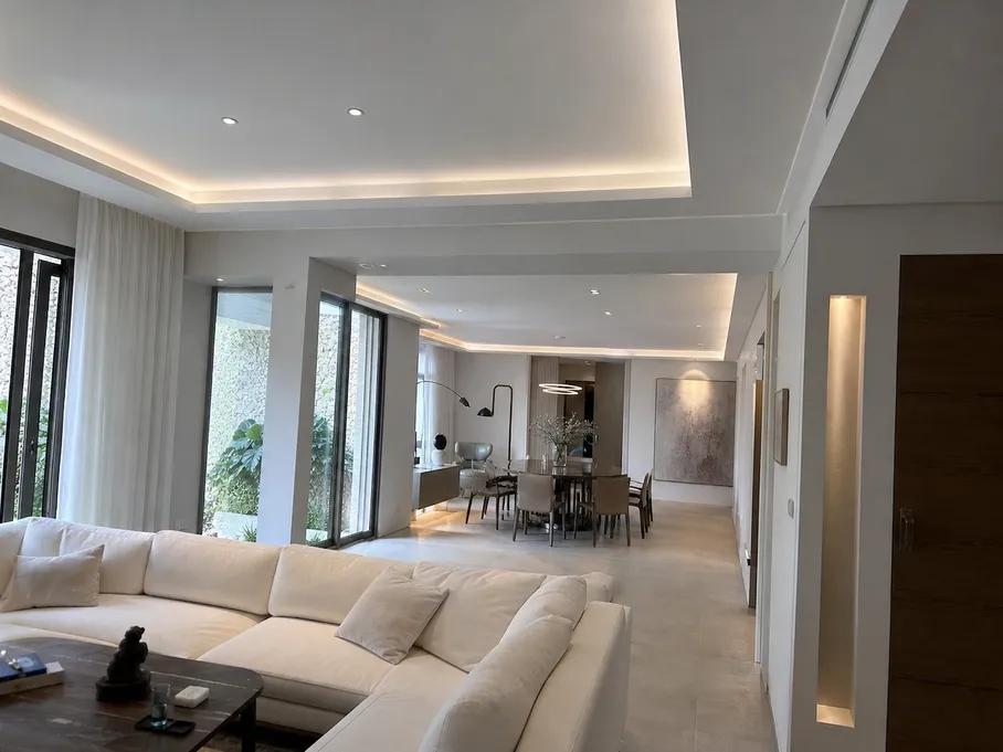 Architectural lighting installation in a luxury villa featuring cove profiles and accent fixtures