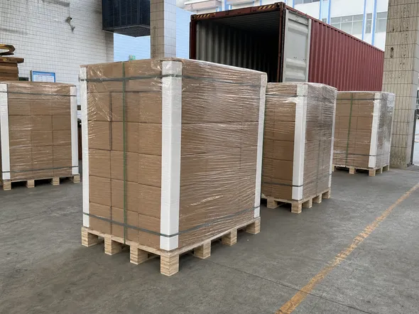 Pallet-packed architectural lighting shipment with stretch wrap and corner protection ready for container loading