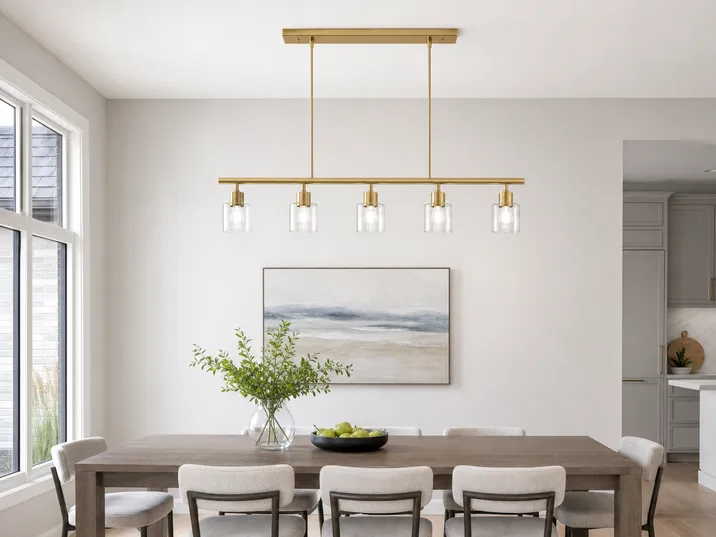 Linear bar pendant with brushed gold finish, 5-head configuration for rectangular dining table