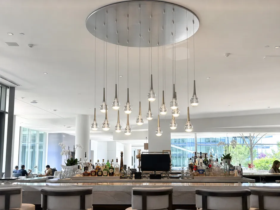 Multi-drop cluster pendant lighting with CNC-machined canopy plate for consistent drop spacing