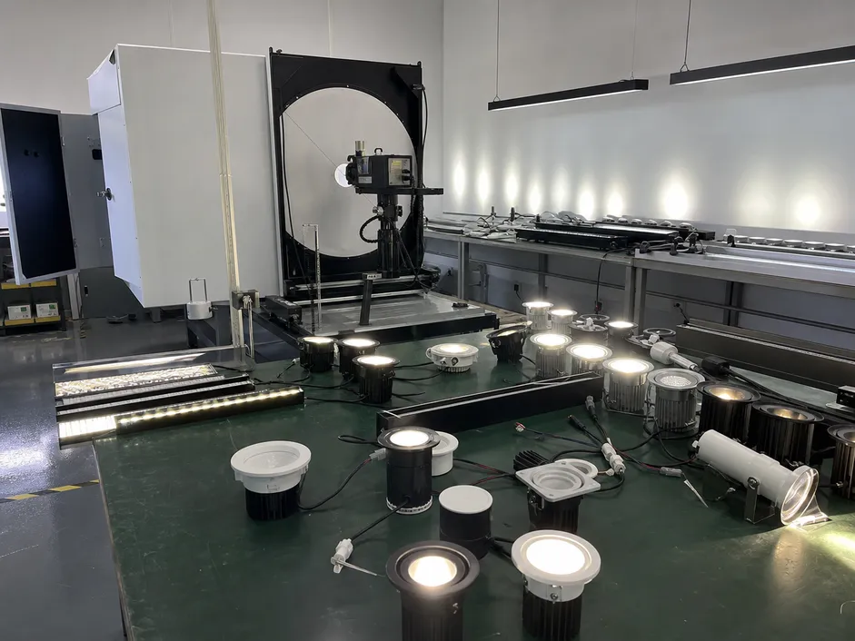 Architectural lighting fixtures including recessed downlights, wall washers, and linear ceiling systems with precise photometric control