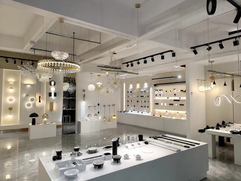 ASCLighting's six decorative and architectural lighting collections displayed in a factory showroom setting