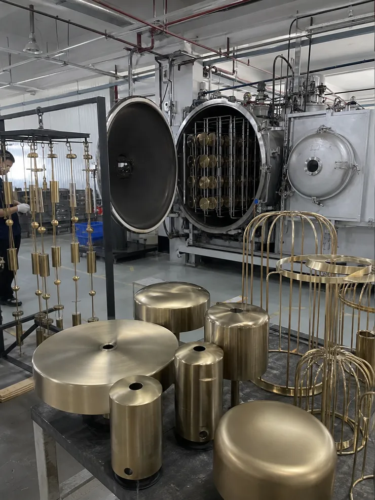 In-house PVD finishing line producing champagne gold and brushed brass finishes for luxury lighting