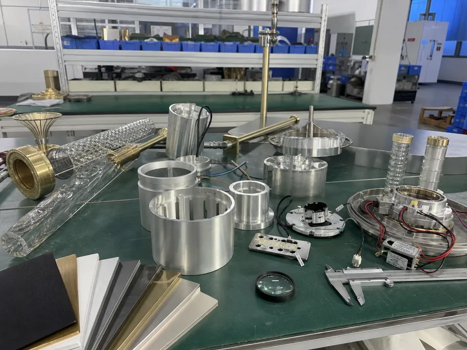 Custom OEM lighting fixture development showing finish samples and prototype components