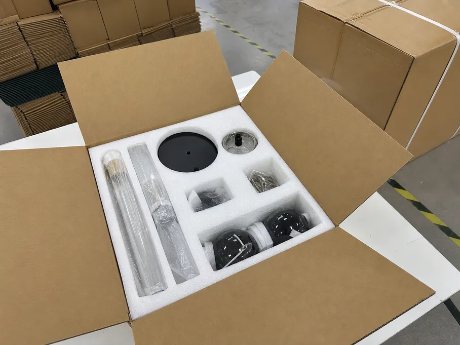 Modern pendant fixture in foam-lined export packaging configured for e-commerce fulfillment