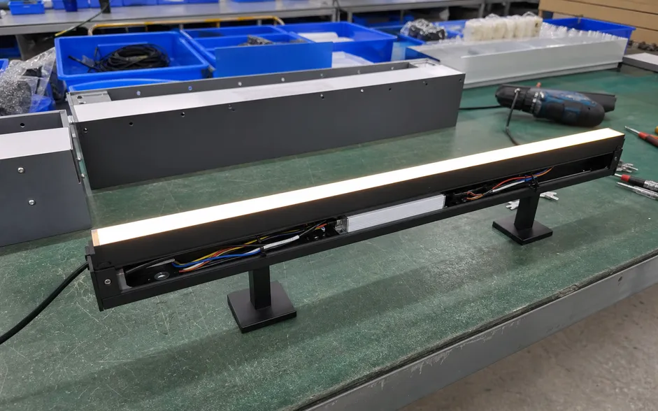 Functional lighting fixture prototype showing powered sample with finish and wiring complete