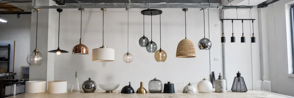 Range of custom pendant lighting options showing different shade materials, finishes, and canopy configurations