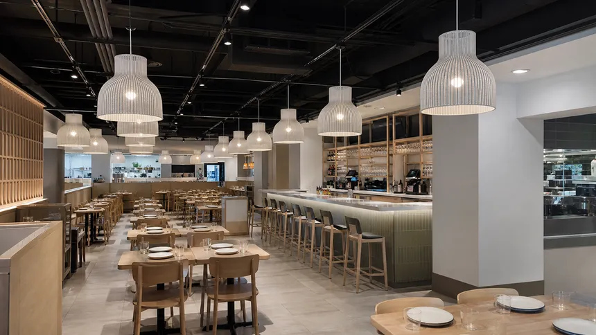 Identical custom pendant fixtures installed across a restaurant chain location