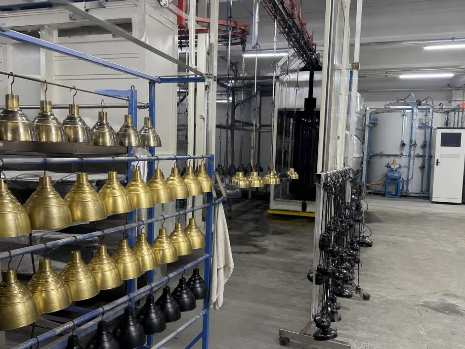 In-house surface finishing line showing powder coating and PVD processes for custom pendant lighting