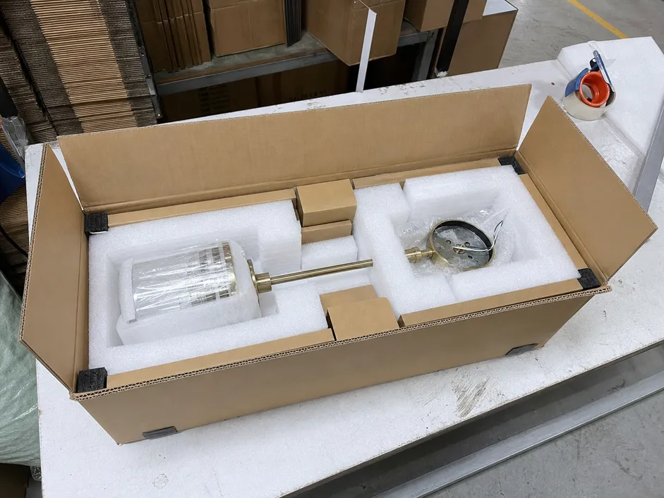 Custom wall sconce in foam-lined protective packaging with outer carton reinforcement