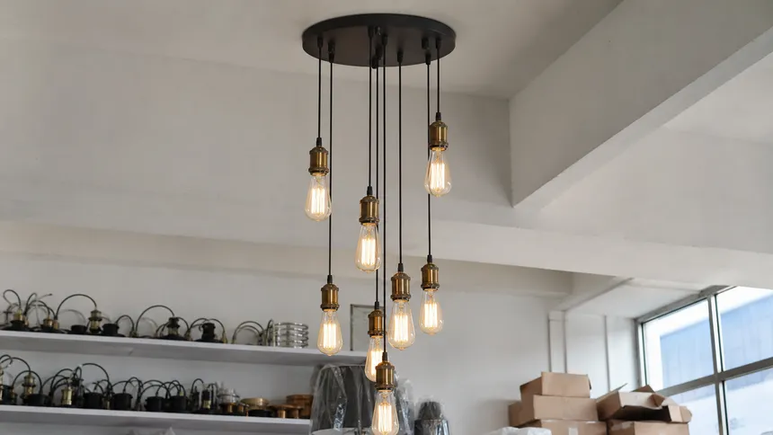 Bare socket Edison-style cluster pendant configuration with decorative sockets and exposed filament bulbs
