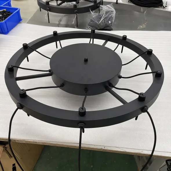 Secondary concentric canopy ring distributing cord exits radially for 8+ drop cluster pendant fixtures