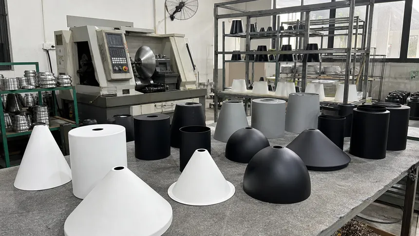 CNC spun aluminum shades in cone, dome, and cylinder profiles with powder coat finish for cluster pendant fixtures
