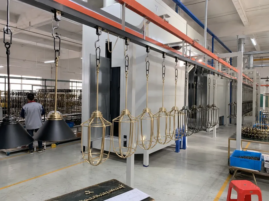 Automated powder coating line for entryway pendant lighting finish consistency