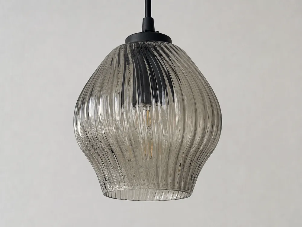 Ribbed textured glass pendant showing pressed exterior surface pattern