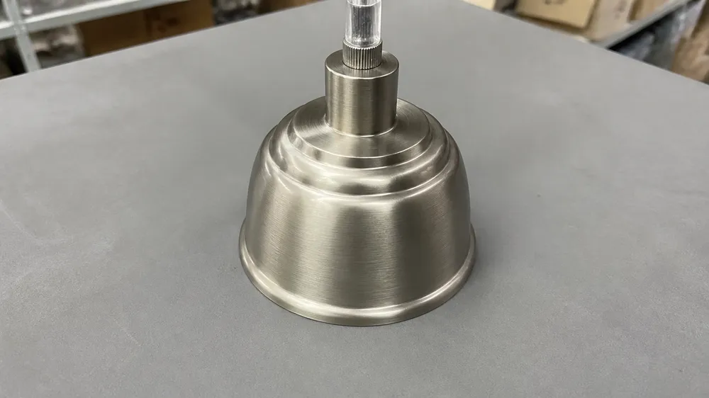 Brushed nickel pendant lighting finish showing cool silver tone with directional brushed texture