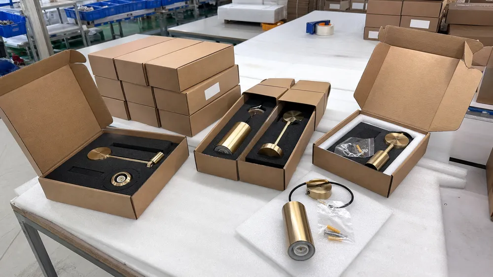 Gold pendant lighting with individual foam-lined carton packaging ready for e-commerce fulfillment