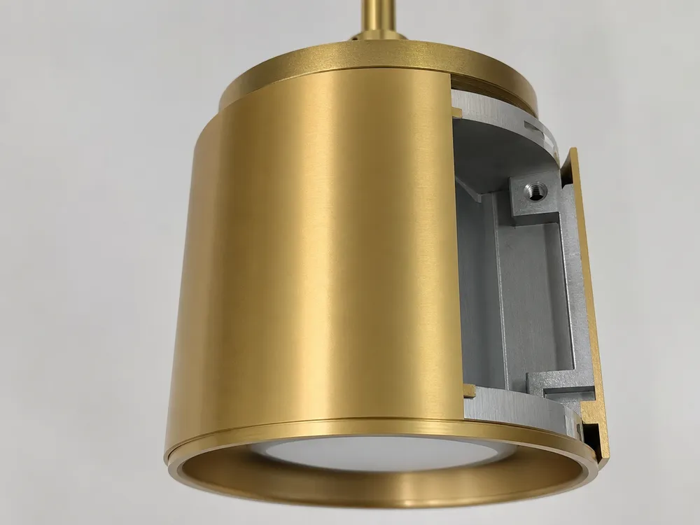 Gold pendant lighting technical detail showing PVD finish and aluminum alloy housing construction