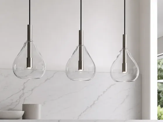 Glass pendant lighting with blown glass shades and metal hardware
