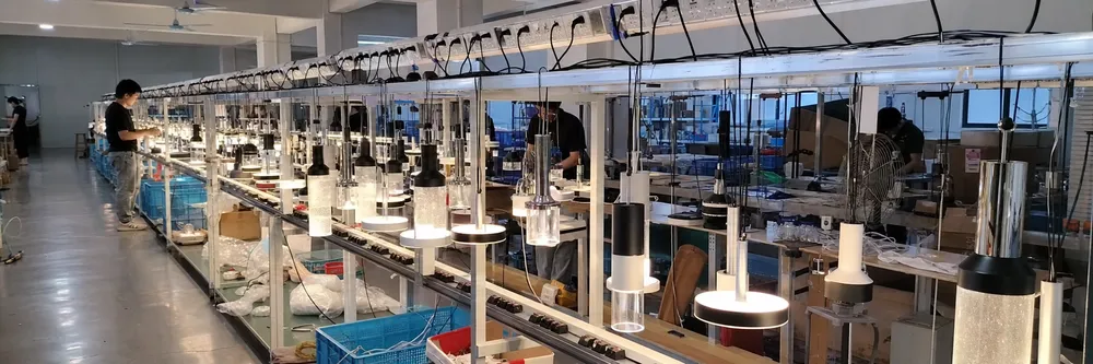 Pendant lighting aging test line with fixtures powered during burn-in quality control