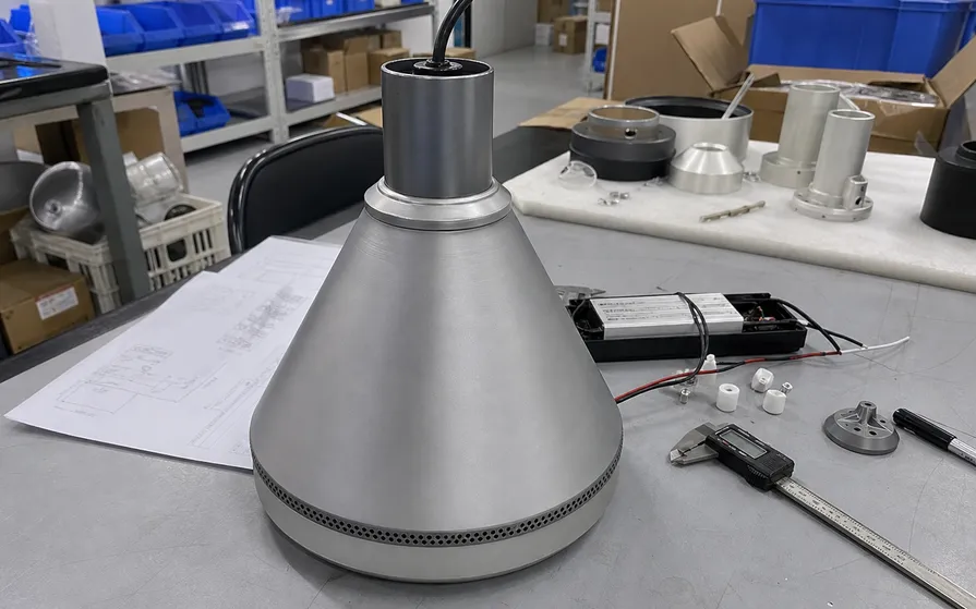 CNC-machined pendant lighting prototype with provisional surface finishing in the R&D lab