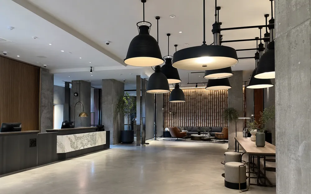Industrial pendant lighting in boutique hotel lobby